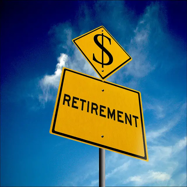 a signboard with the word retirement and money symbol.