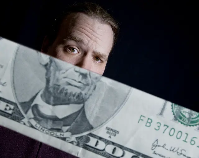 A man on a US dollar bill.