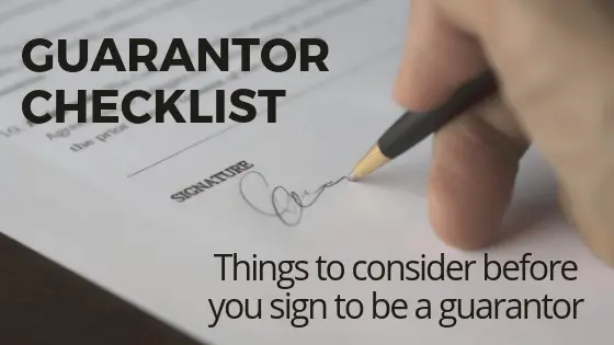 A person signing on a document with wording guarantor checklist