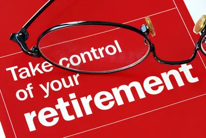 A pair of spectacles on words 'take control of your retirement'.