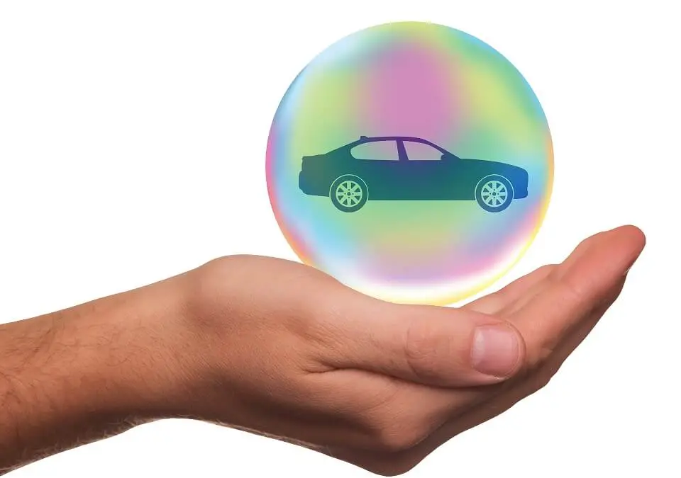 Right hand protecting car in a bubble.