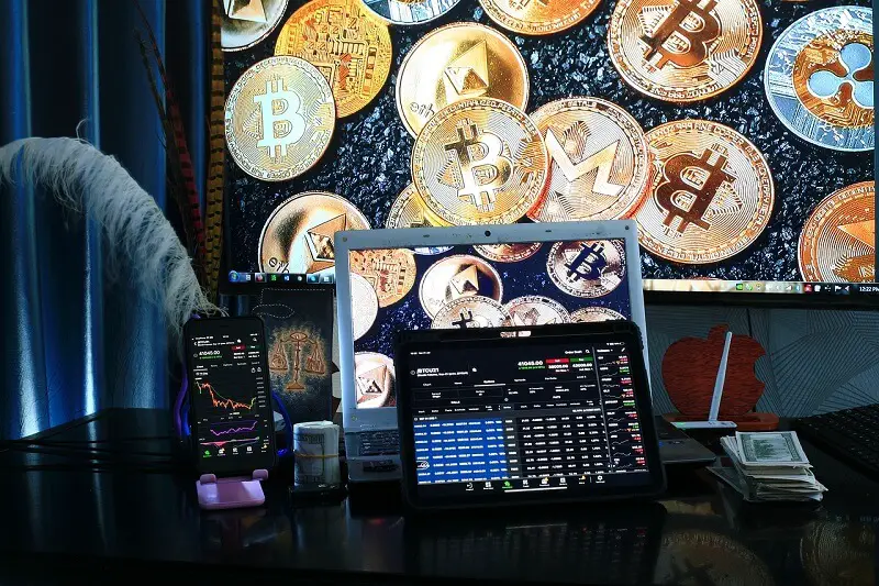 multiple crypto trading platforms on laptop and mobile
